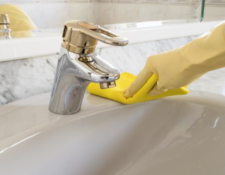 Safety-focused carpet cleaning process with attention to hazard control and surface protection